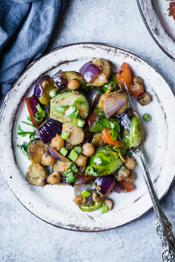 Vegan and gluten free kung pao chickpea & brussels sprouts stir fry made in one pan with a delicious homemade sauce and plenty of protein. This vegetarian dish is perfect for meal-prep!
