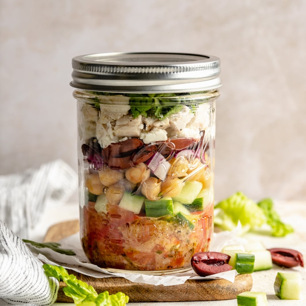 Greek salad mason jar with halal chicken feta olives cucumber for portable cold lunch