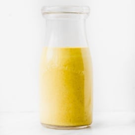 healthy curry tahini dressing in a jar