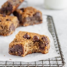 flourless chocolate chip chickpea blondies on a wire rack