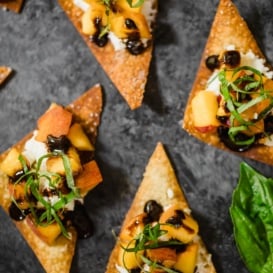 peach and goat cheese wonton bites with shredded basil