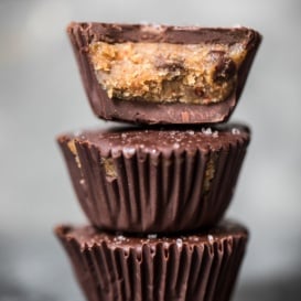three vegan cookie dough cups in a stack