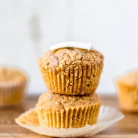 two sweet potato cornbread muffins in a stack