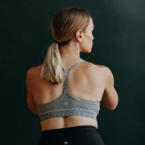 back of a woman in a sports bra