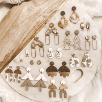 pairs of earrings on a round board
