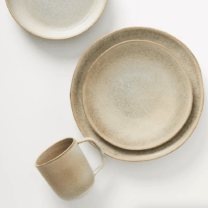 tan dinner plates and a mug