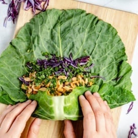 wrapping a collard leaf into a collard wrap