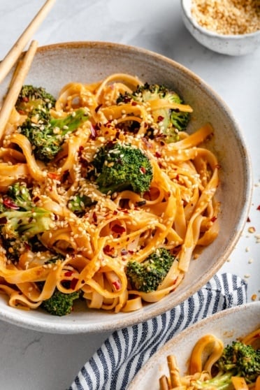 vegan tahini noodles with broccoli in a bowl