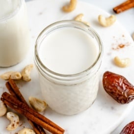 homemade cinnamon date cashew milk in a glass