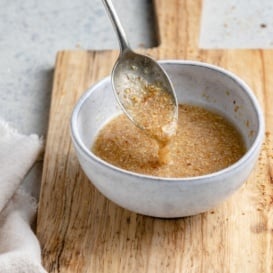 spooning up a flax egg from a bowl