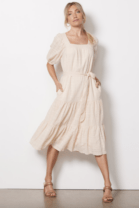 woman in a long beige dress