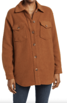 person wearing a burnt orange shirt