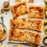 pear puff pastry tart sliced on parchment paper