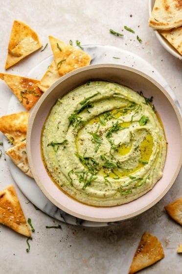 garlic basil white bean hummus in a bowl