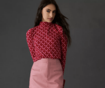 woman in a red patterned turtleneck