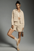 woman in a houndstooth jacket