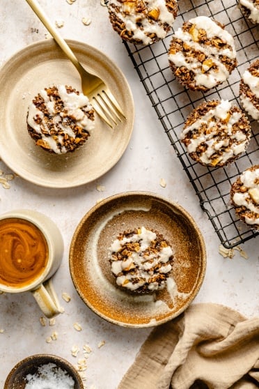 gingerbread oatmeal cups on plates and on a wire rack
