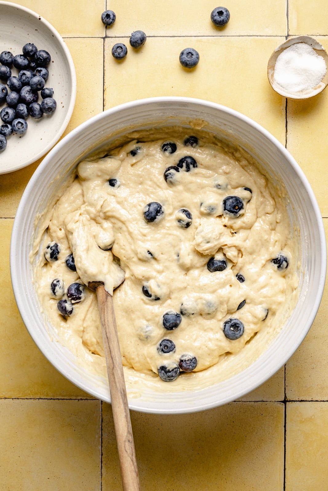mixing batter for healthy blueberry yogurt muffins