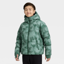 young boy in a green jacket