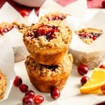 two cranberry orange muffins in a stack