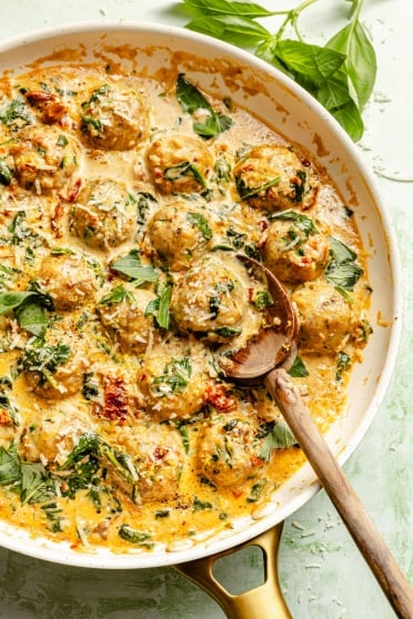 chicken florentine meatballs in a skillet