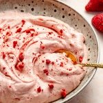 strawberry cream cheese frosting in a bowl
