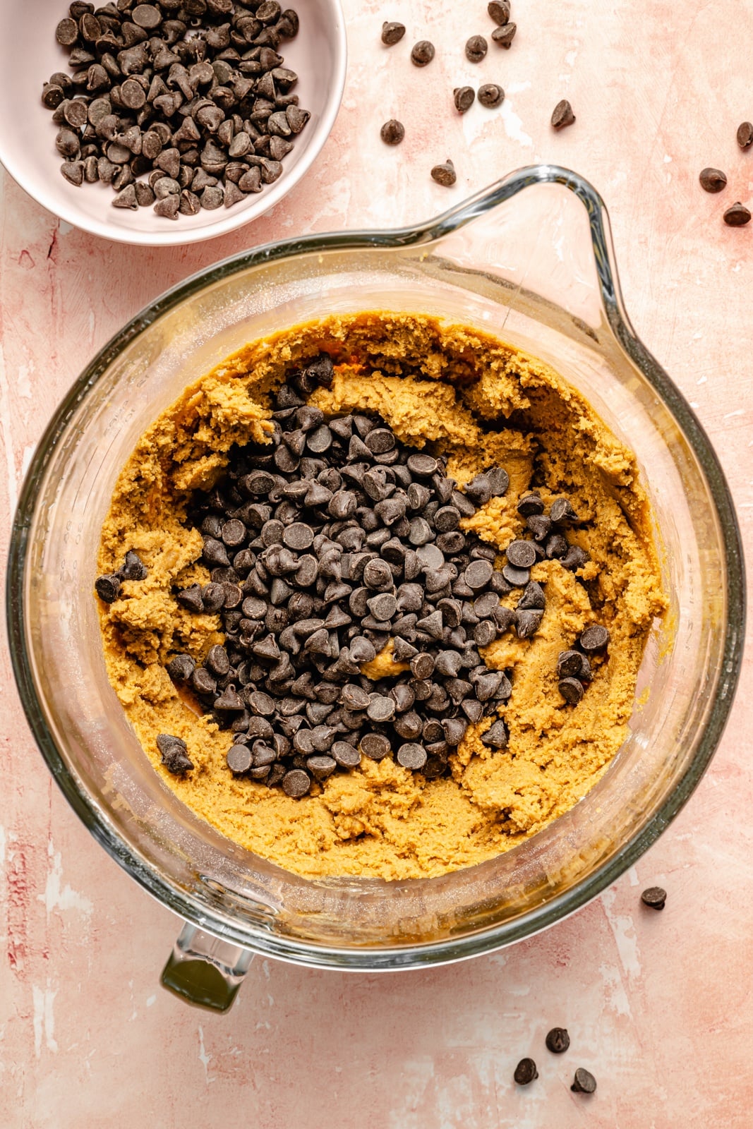 dough for scoopable chocolate chip cookies in a glass bowl
