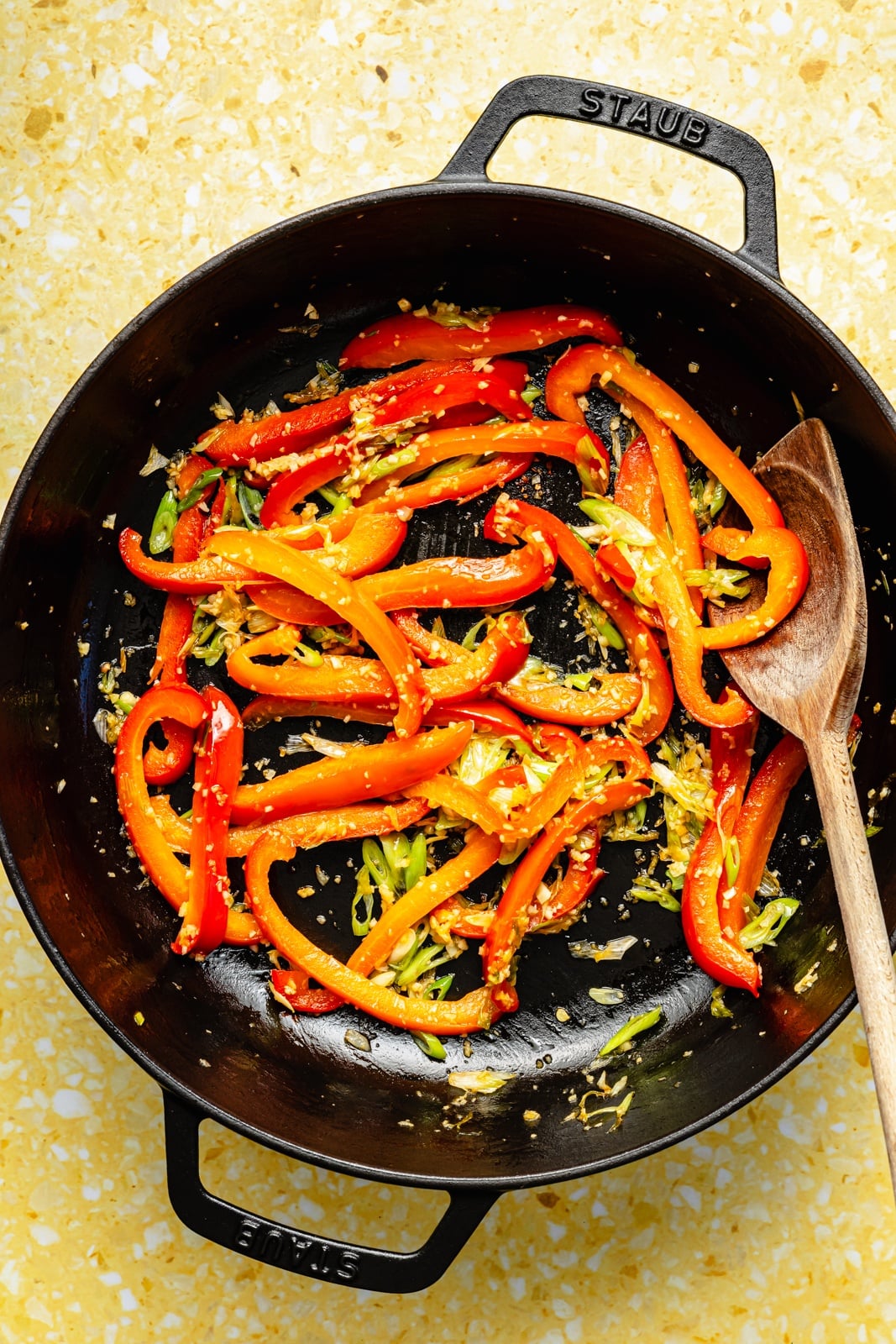 stir-frying vegetables for ginger chicken noodles