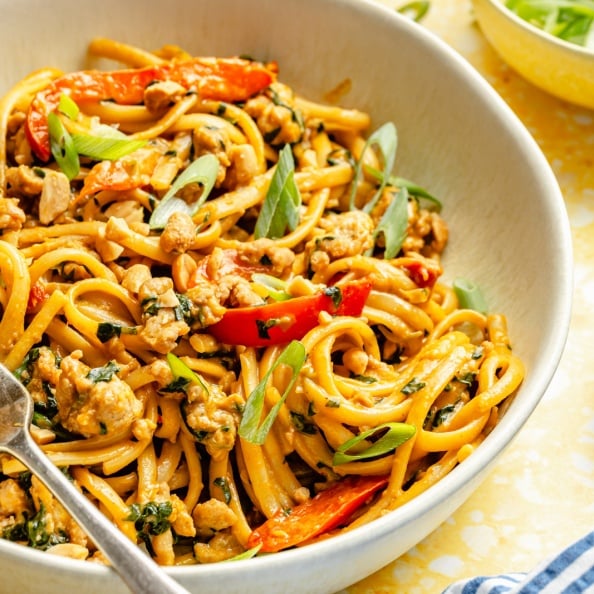 ginger chicken peanut noodles in a bowl