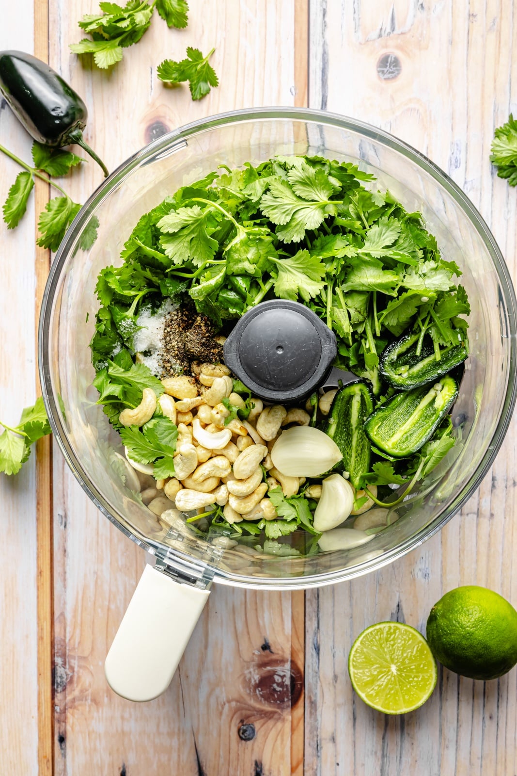 ingredients for homemade pesto in a food processor