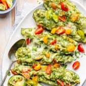 pesto chicken zucchini boats on a platter