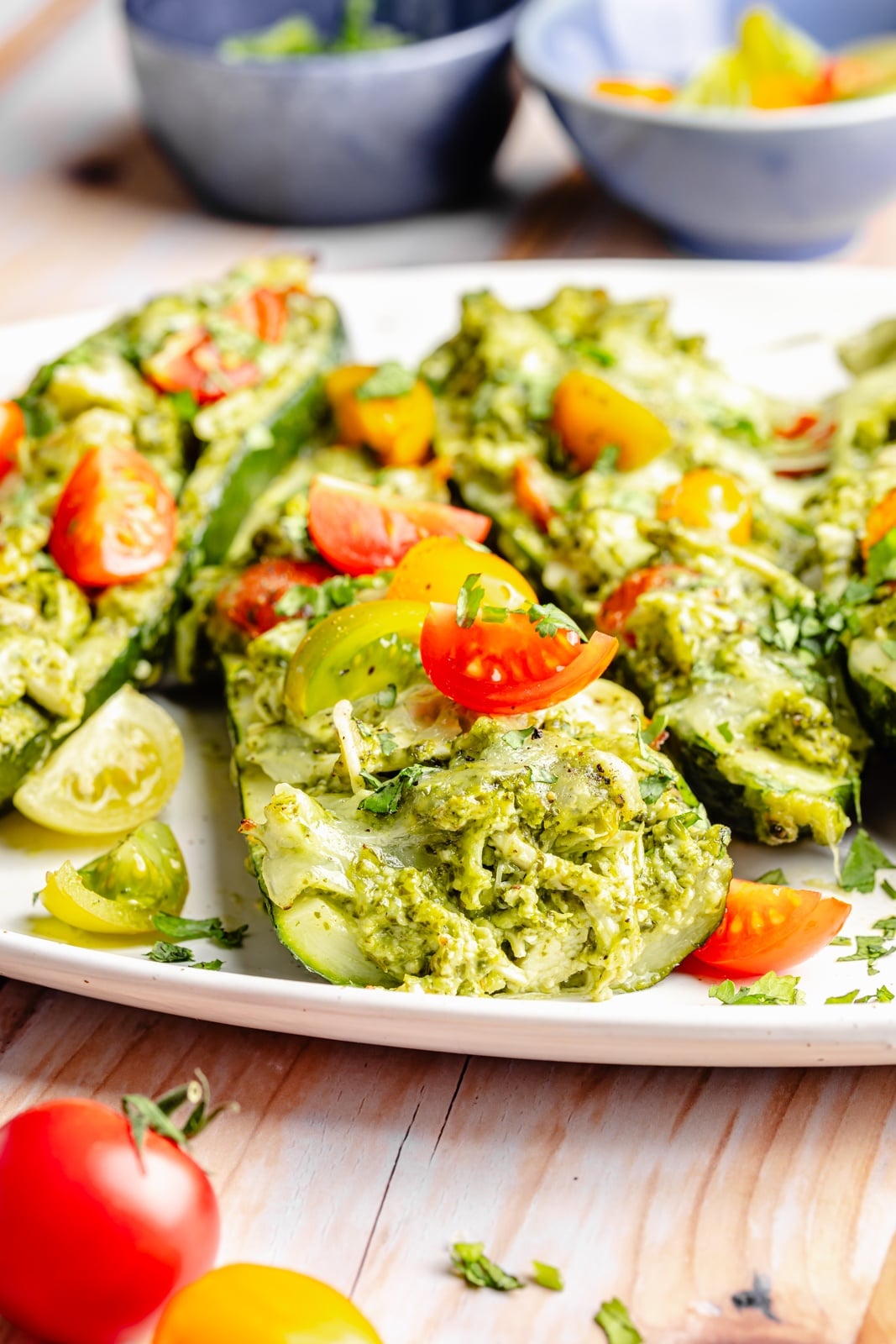 pesto chicken stuffed zucchini on a platter