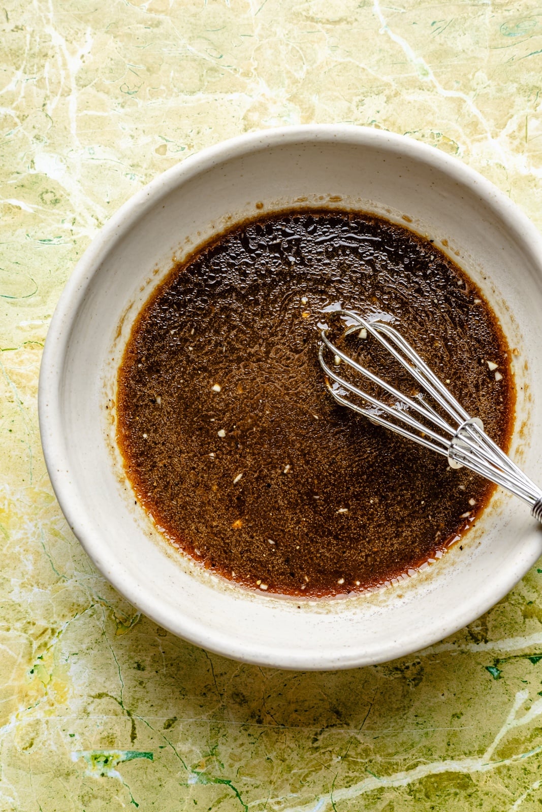 balsamic dressing in a bowl for a peach spinach salad