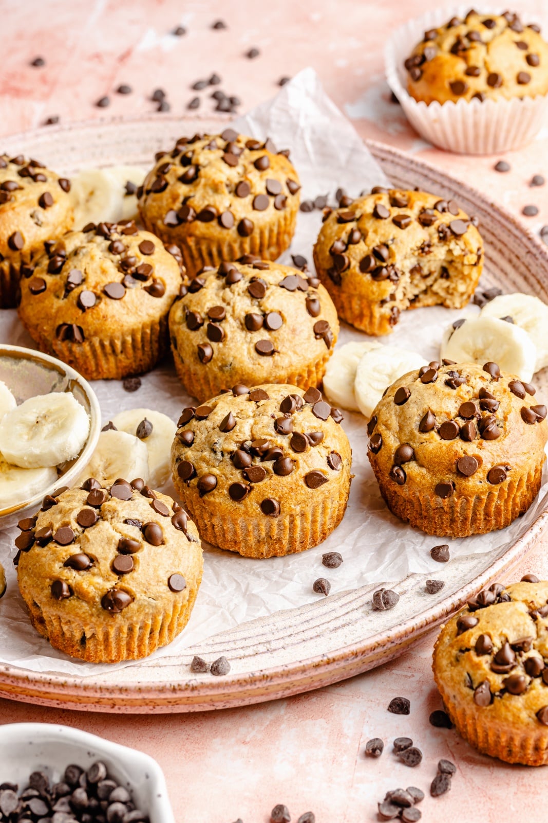 Healthy peanut butter banana muffins packed with protein and peanut butter flavor. These gluten-free peanut butter banana muffins are naturally sweetened with pure maple syrup, dairy-free, and a great on-the-go healthy breakfast or snack. Try them with mini chocolate chips! healthy peanut butter banana muffins on a tray