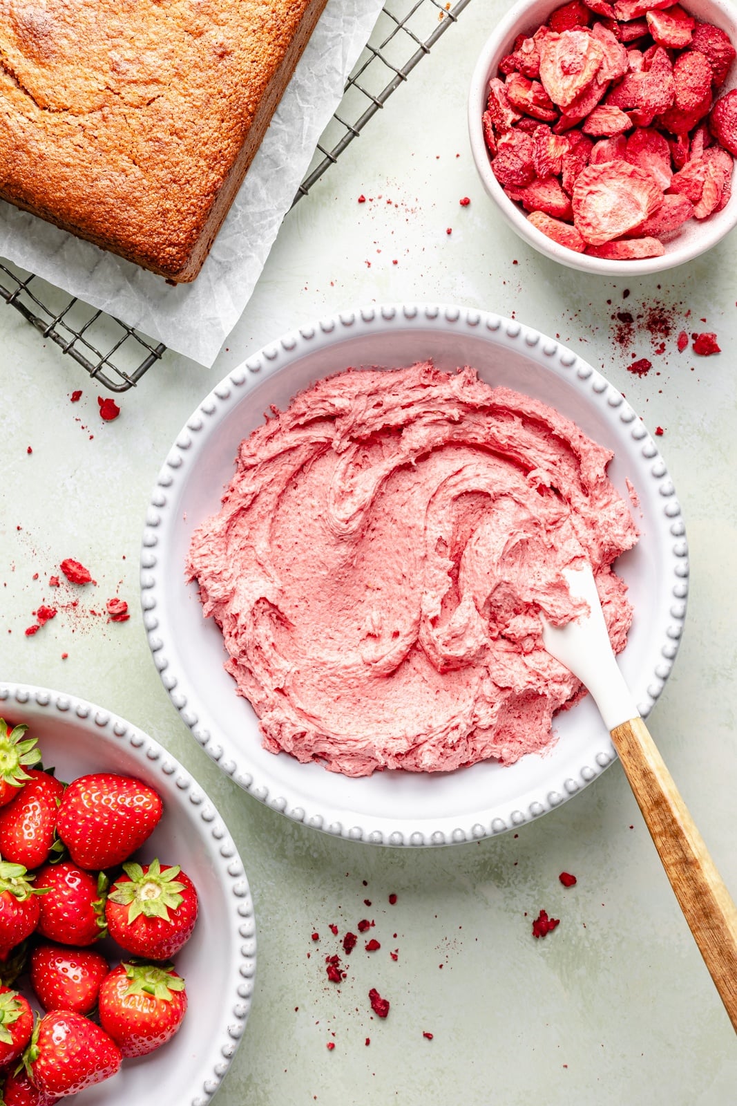 mixing strawberry frosting for a healthy strawberry cake