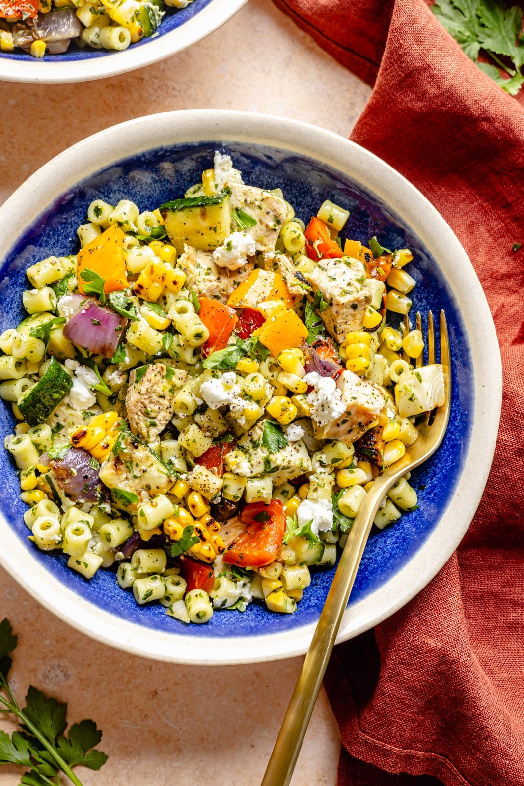 chimichurri pasta salad with grilled chicken and veggies in a bowl