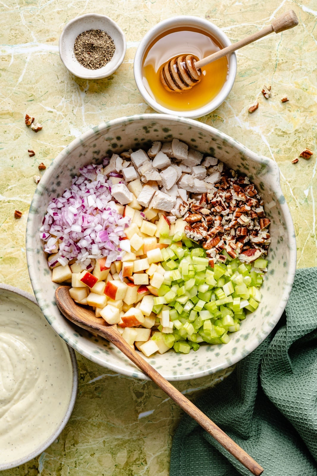 Fresh, high-protein honey mustard chicken salad mixed with a flavorful Greek yogurt-based dressing, juicy honeycrisp apples, and plenty of crunch from celery and nuts. Scoop it with crackers or enjoy it as a sandwich or wrap for the perfect no cook lunch that's ready in 15 minutes! unmixed honey mustard chicken salad in a bowl