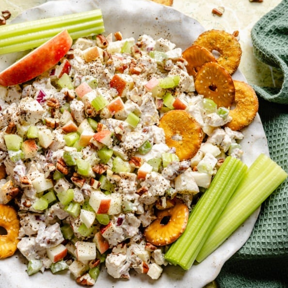 honey mustard chicken salad with apples and celery in a bowl
