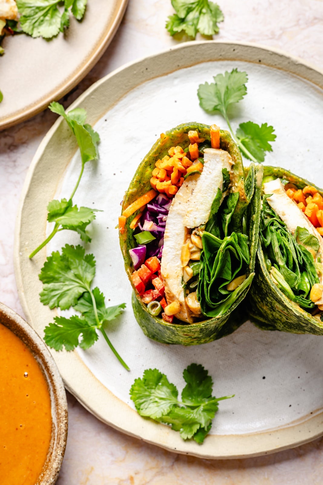 thai chicken wrap sliced on a plate